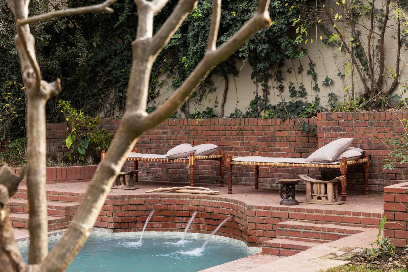 Outdoor cold plunge pool with brick terracing at The Well, Johannesburg