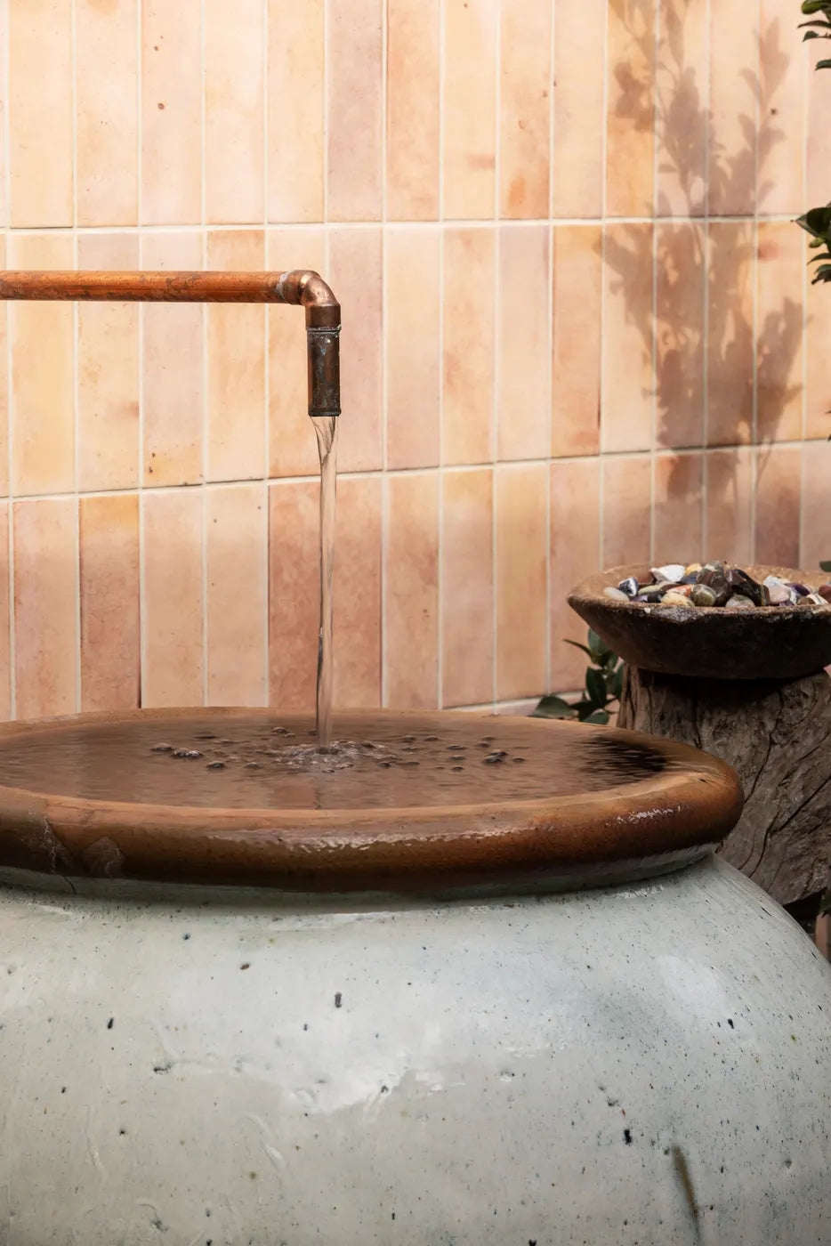 Thermal therapy room with stone basin and pink zellige tiles at The Well