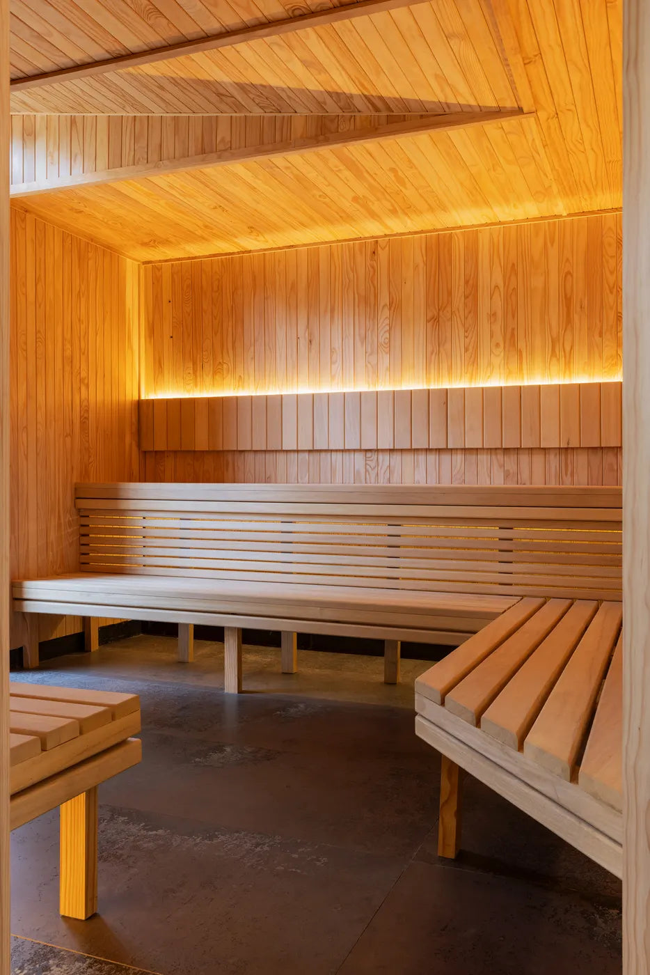 Wood-lined infrared sauna interior at The Well, Johannesburg