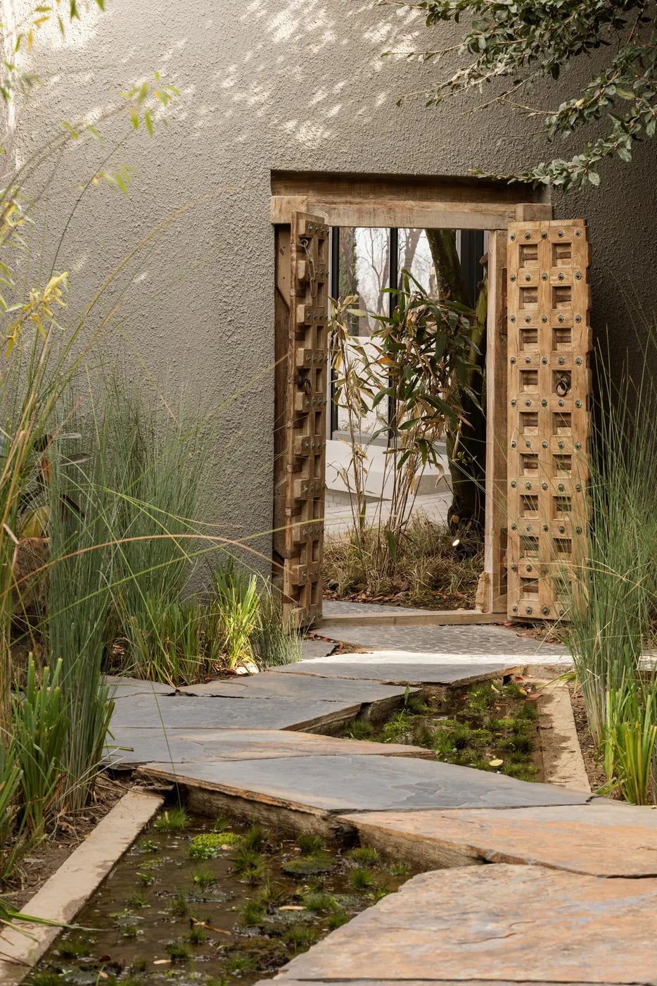 Garden mirror feature and stepping stones at The Well